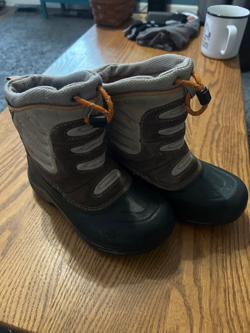 The North Face Kids Gray and Black Waterproof Snow Boots with Orange Toggles